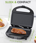 OSTBA 2 Slice Sandwich Maker Grill With Powerful 750W Non Stick Plates For Fast Even Toasting, showing steak inside grill.