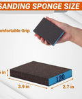 Holding a 120 grit sanding block from 12 Pack Sanding Block With 60 80 120 220 Grit Sanding Sponges Washable And Reusable