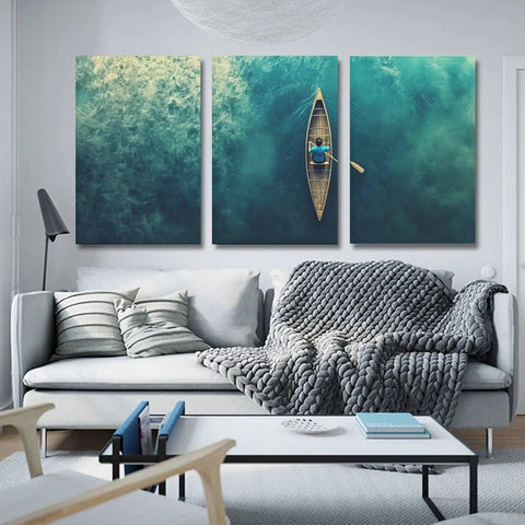 Trio of Teal Ocean Canoe Wall Art Canvas Print for Living Room with Modern Aesthetic Seascape and Floral Touch
