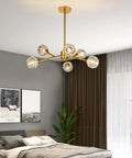 Gold Sputnik Crystal Chandelier, 6 Light Modern Dining Room Fixture Over Table in a bedroom setting