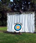 80 lb Archery Backstop 5x6ft Heavy Duty Nylon Target Net for Backyard Practice with Compound and Recurve Bows White displayed outdoors