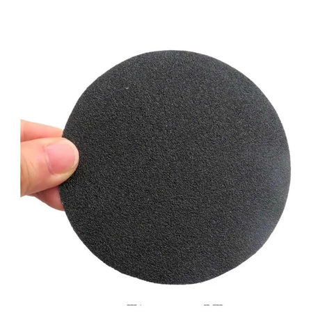 Grab These 30 Pcs 4 Inch Silicon Carbide Sanding Discs With Hook And Loop Back For Smooth Polishing And Heavy Duty Prep Jobs Across All Grit Levels From Rough To Razor Sharp Finish, showing a single 4 inch disc held by a hand.