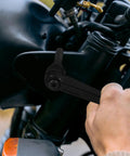 Zero Hassle Adjustable Clamping Lever Handles Built Tough With Durable Aluminum Alloy Threaded Hand Grip For Industrial Machinery Tooling Maintenance Quick Turn Ratchet Crank Set Of Four in use tightening bolts on a motorcycle.