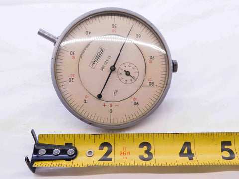Dial Test Indicator 0 To 1 Inch Travel With.001 Inch Graduation, Precision Machining Gauge next to measuring tape