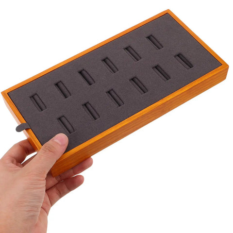 Slick Gray Solid Wood Jewelry Display Tray Featuring 12 Ring Slots top view held in hand showcasing grey felt interior for jewelry organization.