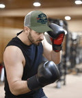 Man boxing in gym wearing Full Moon USA Flag Statement Hat For Men Trucker Cap Army Green Dope Cool Breathable Baseball Cap