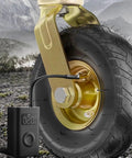 Badass 10 Inch Rubber Caster Wheels Set Of 4 With Upgraded Ball Bearings and Thick Steel Plates mounted on a rugged terrain.