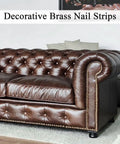 Pro Grade Upholstery Tack Strip Featuring No Sweat Install Heavy Duty Brass Nailhead Trim With Antique Rivets For Sofa Couch Reupholstering And Diy Home Upgrade on a brown tufted leather sofa.