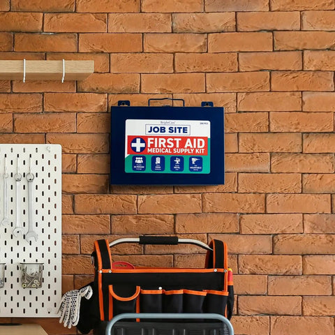 Blue metal wall-mount first aid kit with 200-piece contents on brick wall