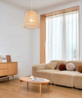 Galen 2-Light Chandelier With Bamboo And Rattan Shade, Japandi style lighting in modern living room with natural wood tones.