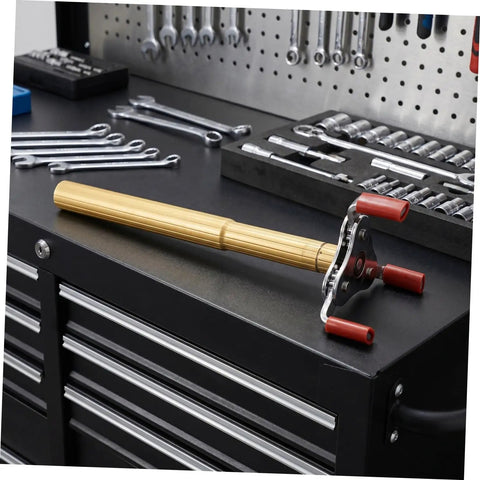 Heavy Duty Ceiling Detector Removal Tool With Badass Rubberized Claw And Extendable Aluminum Shaft resting on a tool chest.