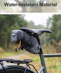 Expandable Bike Seat Bag Under Seat Waterproof Saddle Bag For Mountain Road And Commuter Bikes 1.5L To 2L Capacity attached.