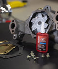 Medium Strength Surface Insensitive Threadlocker For 1/4 To 3/4 Inch Fasteners with automotive parts on black surface