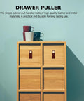 Drawer puller in wood cabinet with mugs on top, showcasing 2 Pack Classic Brown Cabinet Door Handles No Fuss Single Hole Mount Solid Brass Drawer Pulls For Wardrobes And Furniture Easy Install Stylish Home Storage Hardware