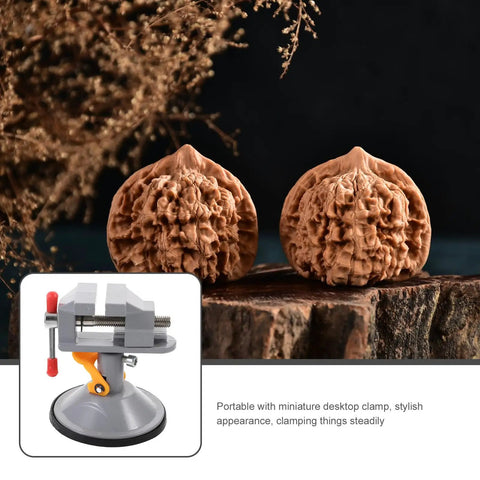 Mini Vise Clamp With Suction Mount Fully Rotatable Bench Vise shown with intricate carvings, portable design