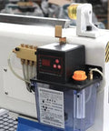 Close-up of Rotary Axis 4 Axis CNC Router With 4x8 Engraving Milling Machine control panel and oil lubrication system.
