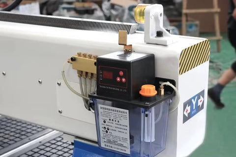 Close-up of Rotary Axis 4 Axis CNC Router With 4x8 Engraving Milling Machine control panel and oil lubrication system.