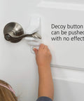 Child trying to open door with Outsmart Lever Handle Lock 2 Pack White Easy Install Kidproof Door Safety for Lever Handles, Fits Most Levers, Keeps Curious Toddlers Safe, One Size Each.
