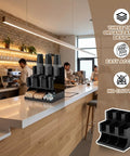Cup And Condiment Station Organizer For Coffee Bar, Acrylic Dispenser With Nine Compartments, Black on a bustling café counter