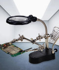 4X LED Magnifier Soldering Station with light, adjustable stand and auxiliary clips holding a circuit board for repair.
