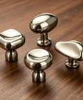 Titanium Silver Mushroom Cabinet Knobs 1.28 Inch Round Zinc Alloy Drawer Knobs on wooden surface