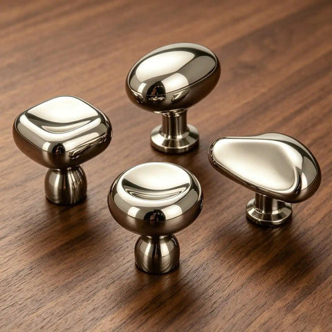 Titanium Silver Round Dome Cabinet Knobs 1.07 Inch Polished Chrome Zinc Alloy Drawer Pulls on wooden surface, pack of four.