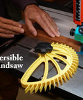 Yellow Hedgehog featherboard for table saws with black knob, mounted on the saw beside a wood workpiece