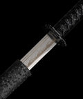 Close-up of Real Carbon Steel Katana for Iaido Practice and Display, showing unsharpened blade and full tang samurai sword handle.