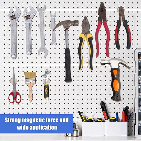 Pegboard wall with assorted hand tools (wrenches, pliers, hammer, scissors, paintbrush) and a small storage tray.