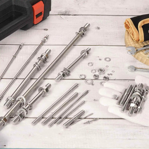 Six Piece M8x65mm Double Ended Stud Screws Set in 304 Stainless Steel with Nuts and Washers on a wooden backdrop