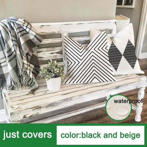 Outdoor Pillow Covers 20x20 Waterproof Sunbrella Fabric Black And Beige on patio bench with plants.