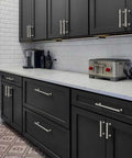 Rock Solid Heavy Duty Zinc Alloy Cabinet Pulls Set Of 10 In Brushed Satin Nickel Finish for kitchen cabinets, visible on dark drawers.