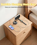 Three Inch Desktop Power Grommet With 35W USB C Fast Charging And Dual 18W USB A Outlets Black six foot cord on bedside table with devices.