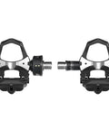 Assioma Uno Single Sensing Left Pedal Power Meter With Bluetooth And ANT Plus Connectivity for road bikes, shown with extra cleats.