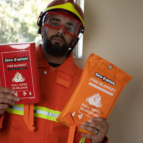 Person holding emergency fire blanket 4 pack 40 by 40 inches fiberglass fire blankets for home kitchen camping car office.