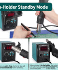 Person using 959D I Digital Hot Air Rework Station for soldering SMD on green circuit board, showing digital display and controls.