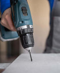 Cordless drill with a 6mm vacuum-brazed diamond tile drill bit drilling into a tile surface.