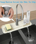2nd Generation Silicone Faucet Mat, Kitchen Silicone Faucet Drip Catcher with Cuttable Circular Central for Kitchen Sink, Tailor-Made for Faucets with Deck Plate【Beige】 shown securing with snap button and water dripping.