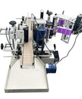 Heavy Duty Desktop Automatic Round Bottle Labeling Machine With Chain Conveyor And Integrated Print Coder For Clear And Gold Foil Labels Works Like A Dream 110V Model top view showing steel components and conveyor.