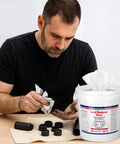 Man using 325 Count Lead Removal Wipes for Shooting Disposable Hand And Surface Cleaning Wipes To Remove Lead Dust Oil And Grime.