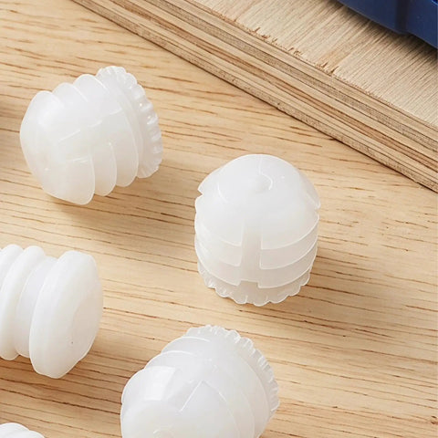 Plastic Dowel Inserts And Mounting Screws For Hinges Kit - M4x8mm White Dowels on wood surface for cabinet doors