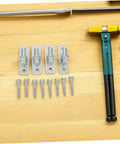 4 Pack Wall Mount Gate Hinges For Barn And Metal Doors Hella Heavy Duty Farm Gate Hardware with tools and screws on a wooden surface.