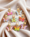 Super Vibrant Sixty Piece Zinc Alloy Keychain Clips With Swivel Lobster Claw Clasps featuring colorful butterfly designs on clips.