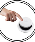 Hand pressing push button on Rock Solid 14 Inch Black Tubular Bathtub Waste And Overflow Assembly with tip toe plug.