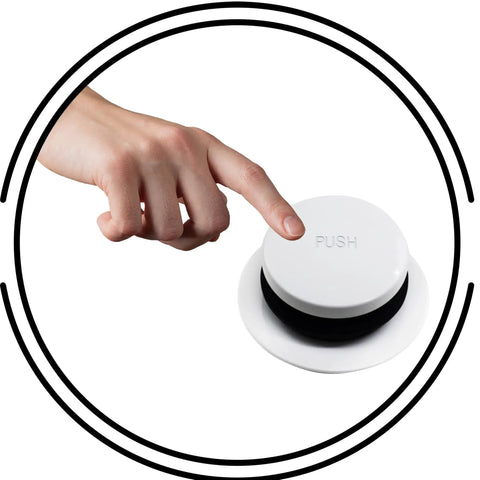 Hand pressing push button on Rock Solid 14 Inch Black Tubular Bathtub Waste And Overflow Assembly with tip toe plug.