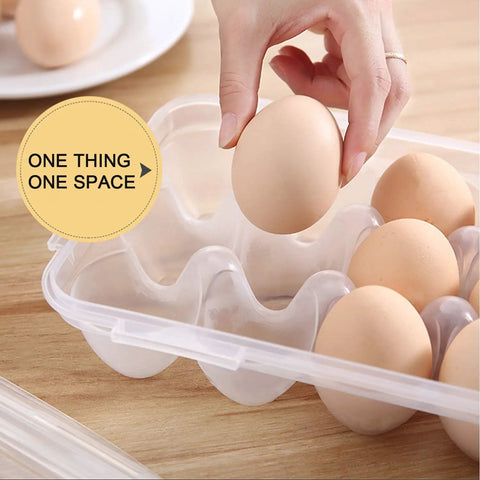 Hand placing an egg into a Two Pack Covered Egg Holders For Fridge Clear Plastic Deviled Egg Tray Carrier With Lids Holds 36 Eggs