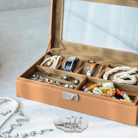 Open jewelry box with watches, bracelets, and the Vintage Metal Toolbox Lock Hasp Latch Set With Screws 6 Piece Small Cabinet Lock