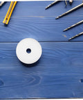 Effortless Swap 5 Pack Nylon Guided Pulley Wheels For Whisper Quiet Glide On Industrial Manure Tracks Patio Doors And Heavy Duty Carts Built Like A Tank, single white nylon wheel on blue wood background.