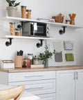 Kitchen shelves secured with Built Tough Pipe Shelf Brackets Set 4 Pack Black L Shaped Iron Shelving Brackets For Shelves Industrial Vintage DIY Pipe Shelf Hardware 4x4 Inch Rustic Farmhouse Mounting Kit, displaying kitchenware and decor.