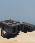 Pocket Sized USB Battery Space Heater Running Smooth With Dual Phone Chargers And Two Comfort Settings Tailor Made For Office Desks Camping Trails Or Road Trips Sweet on a wooden surface against a blue wall.